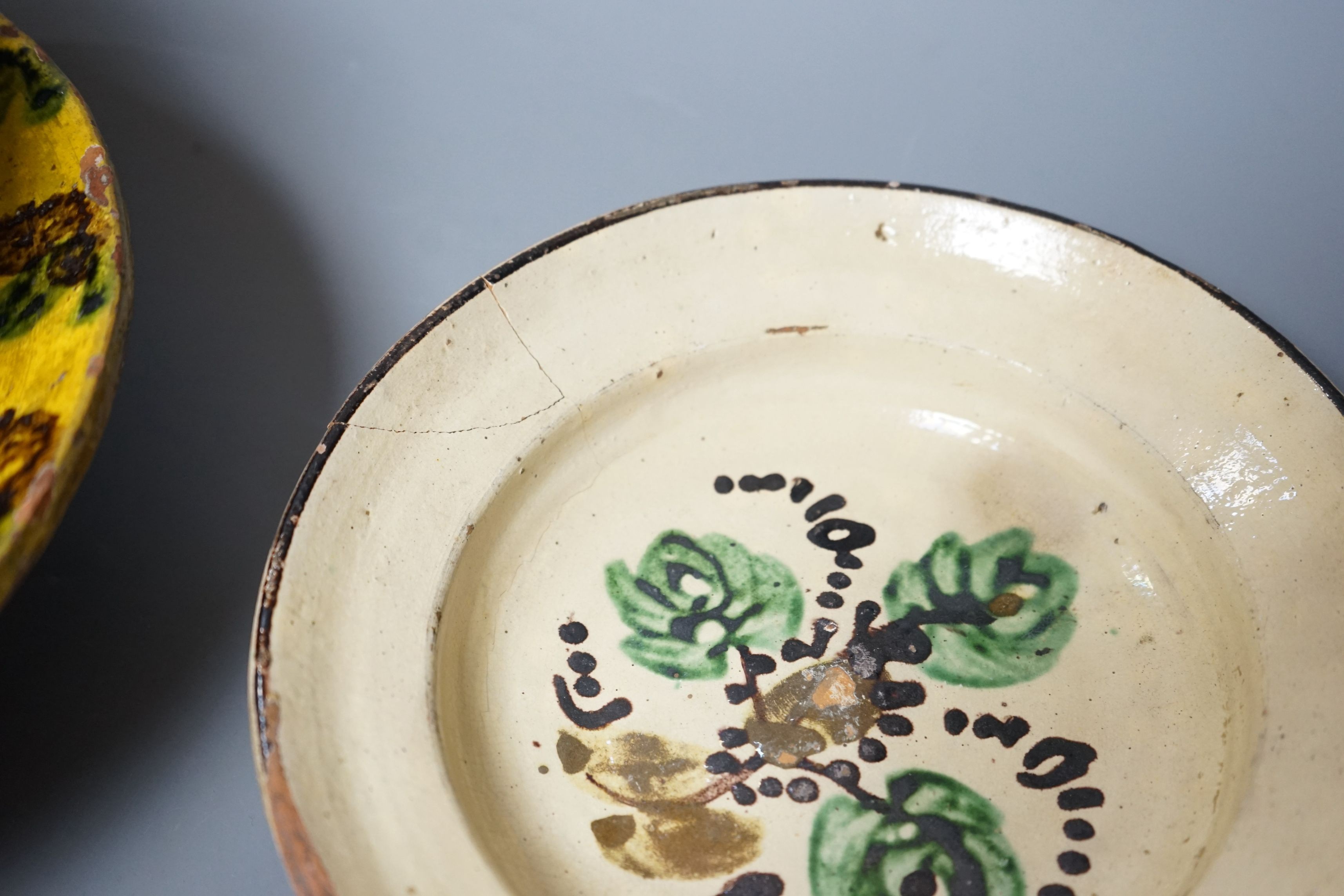 A group of 19th/20th century Continental pottery items to include two sponge ware dishes and a partially glazed jar, largest 20cm, (6)